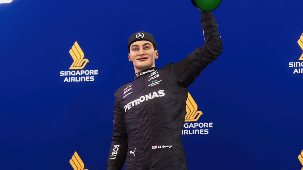Screenshot of George Russell standing on the podium following a Grand Prix, taken from F1 23 on PlayStation 5